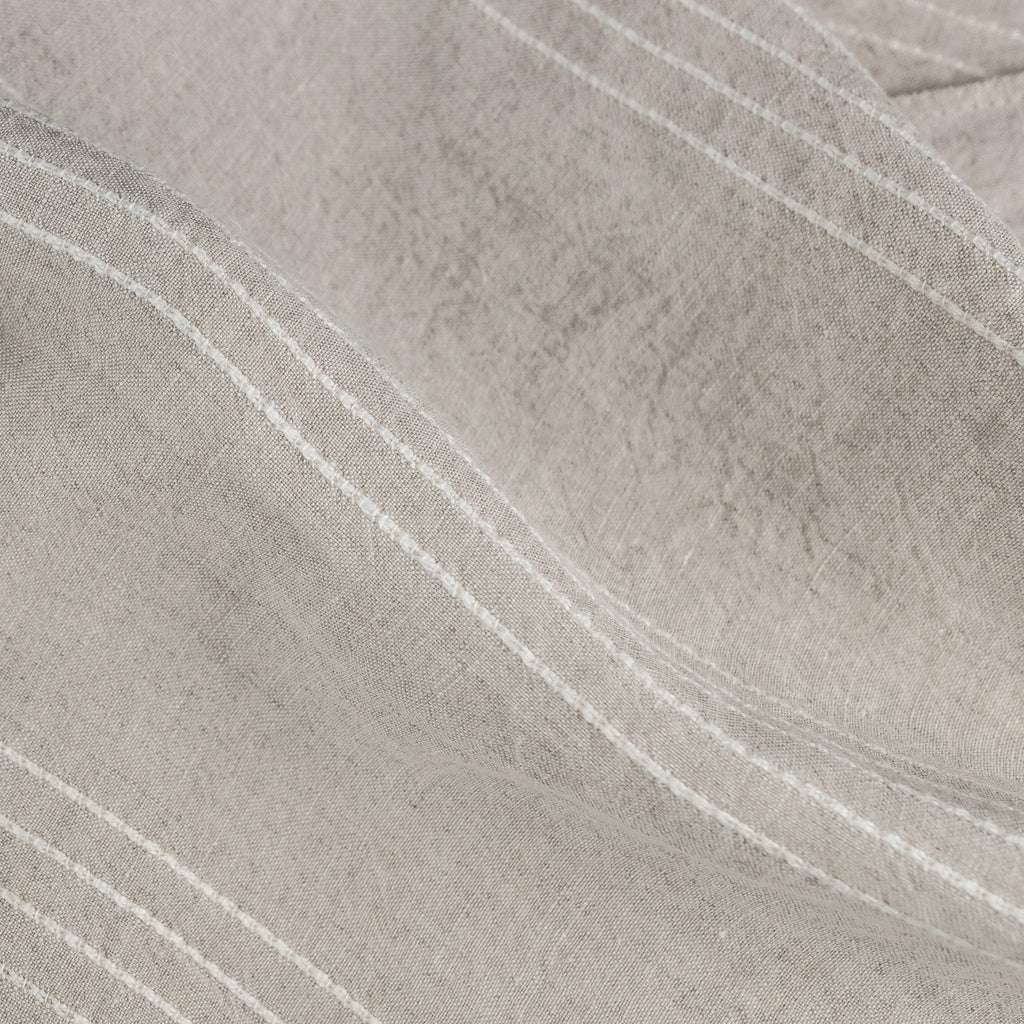 _110 | willow oatmeal - ann rees: Willow, a lightweight beige linen fabric featuring a fine white accent stripe, ideal for enhancing home decor with subtle elegance.